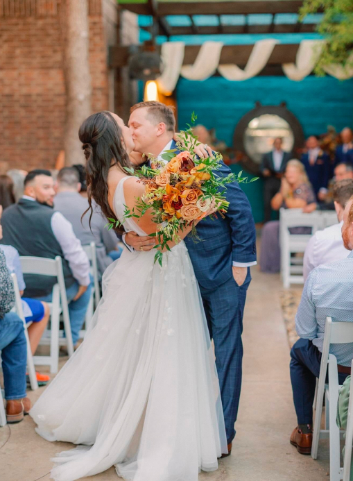Bride and groom kissing