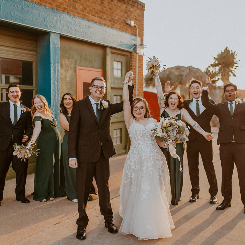 Newlyweds celebrating with their wedding party