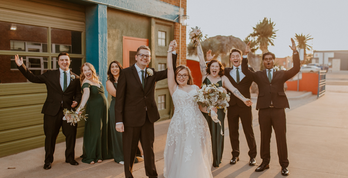 Newlyweds celebrating with their wedding party