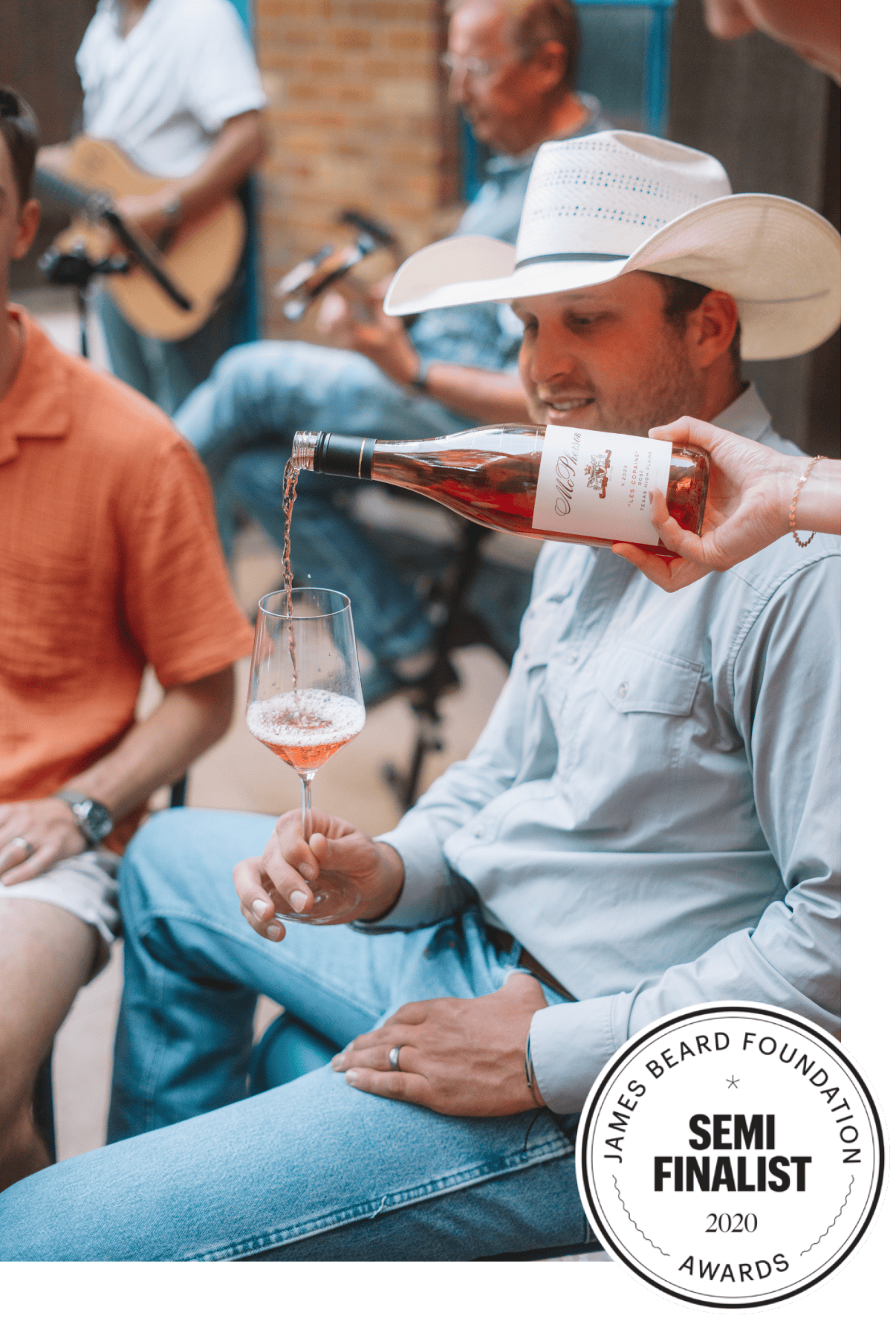 Wine being poured for a cowboy